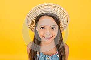 Funny grimace. Stunning girl in hat. Cheerful face. Emotional child. Summer holidays. Fashionably dressed. Enjoying