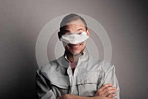 Funny guy mischievous in a medical mask