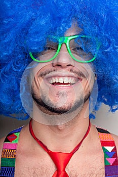 Funny guy naked with blue wig and red tie