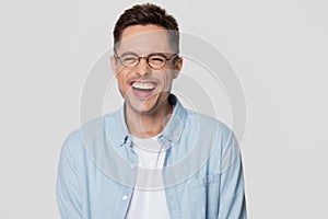 Funny guy nerd wearing glasses laughing looking at camera