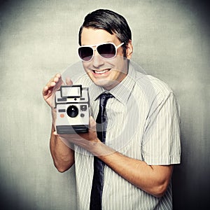 Funny guy wtih instant camera