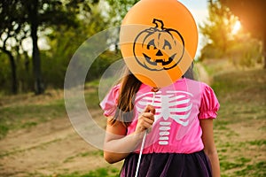 Funny Halloween kid girl carnival costumes with orange balloons