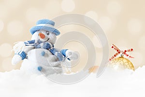 Funny blue snowman on xmas lights bokeh background, white snowflakes, merry Christmas and happy new year card concept