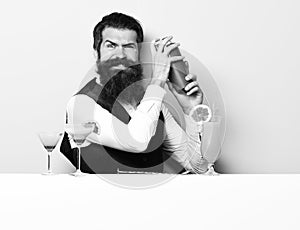 Funny handsome bearded barman on white studio background