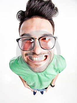 Funny handsome man with hipster glasses smiling wide