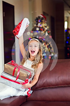 Funny happy child celebrate Christmas and New Year with present