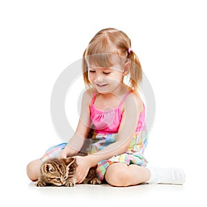 Funny happy child playing with cat kitten