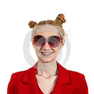 Funny, happy, laughing young girl student, with an interesting hairstyle and sunglasses, openly laughing and looking at