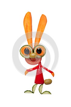 Funny hare made of fresh vegetables on white background