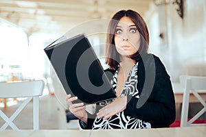 Funny Hungry Pregnant Woman Holding a Food Menu