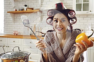 Funny inexperienced housewife feeling stressed and helpless while cooking a meal