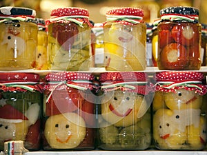 Funny jars of pickled vegetables on town market Budapes Hungary