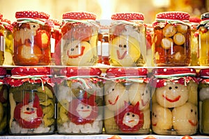 Funny jars of pickled vegetables on town market Budapes Hungary