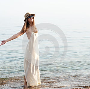 Funny joyful woman enjoy ocean air