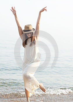 Funny joyful woman have a rest near ocean