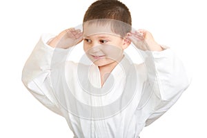 Funny karate kid touching ears