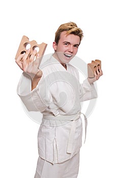 Funny karate man breaking bricks