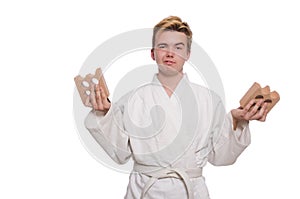Funny karate man breaking bricks