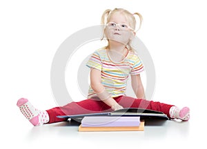 Funny kid in eyeglases reading book isolated on