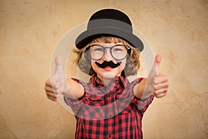 Funny kid with fake mustache