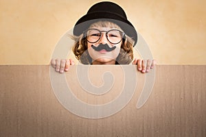 Funny kid with fake mustache
