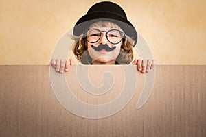 Funny kid with fake mustache photo