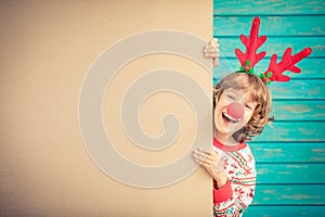 Funny kid holding cardboard banner blank