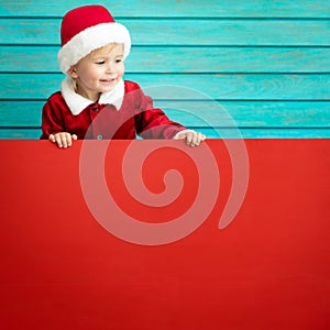 Funny kid holding cardboard banner blank