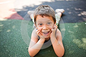 Funny kid sitting on ground