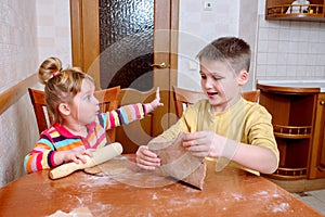 Funny kids bake cookies in kitchen. happy family
