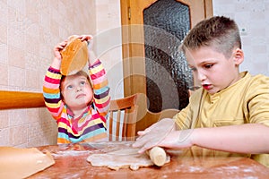 Funny kids bake cookies in kitchen. happy family