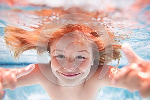 Funny kids face under water. Child swimming underwater in swimming pool. Funny kids face. Kids beach fun. Children swim