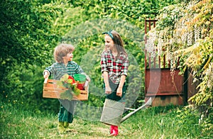 Funny Kids farmers hold box and watering can. Happy Valentines day.