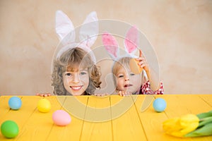 Funny kids wearing Easter bunny