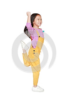 Funny little Asian child girl in pink-yellow dungarees jumping or running over white background. Freedom kid movement concept