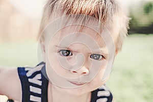 Funny little boy one year old, close-up portrait, head shot