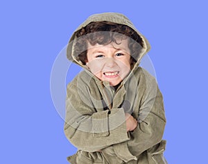 Funny little boy shivering with cold