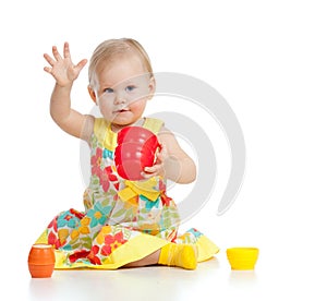 Funny little child playing with cup toy