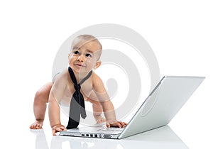 Funny little cute baby businessman with computer