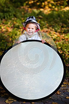 Funny little girl assist the photographer photo