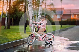 Funny little girl on a bike