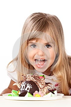 Funny little girl with cake