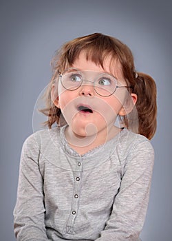 Funny little girl with glasses