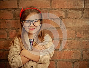 Funny little girl with glasses