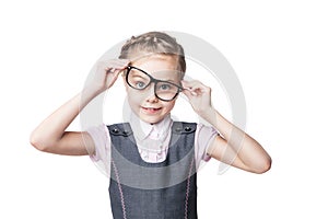 Funny little girl in glasses makes faces