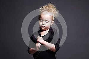 Funny little girl. grimace face child. portrait of emotion kid