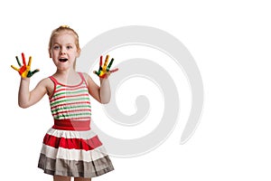 Funny little girl with hands painted in colorful paint. Isolated