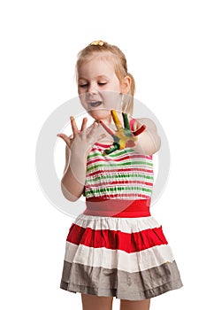 Funny little girl with hands painted in colorful paint. Isolated