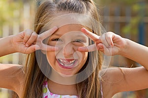 Funny little girl on the playground