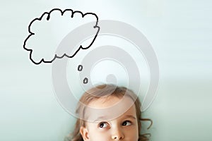 Funny little girl with a speech bubble above her head